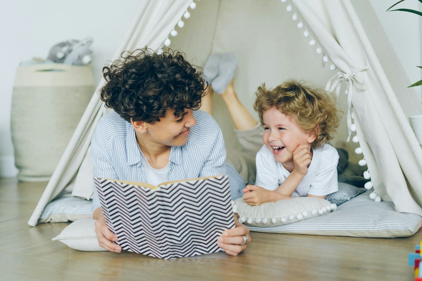 Mother reading to children in a library